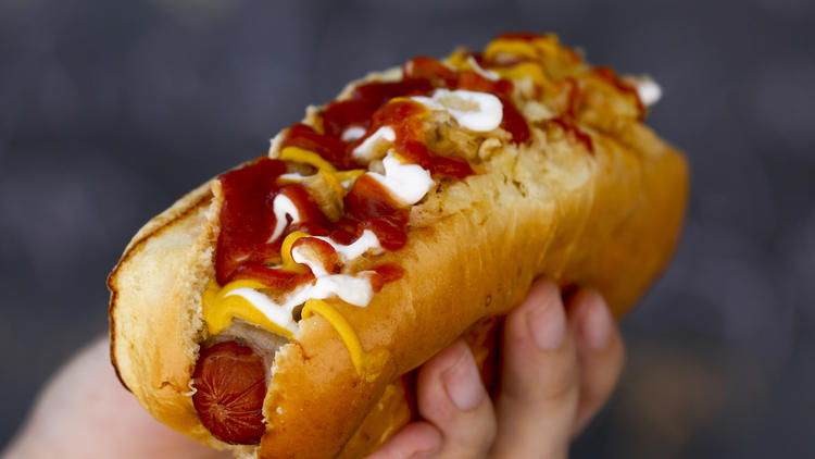 The Cali Dog, a bacon-wrapped hot dog with cheese, coleslaw and pineapple, from Cali Fresh.